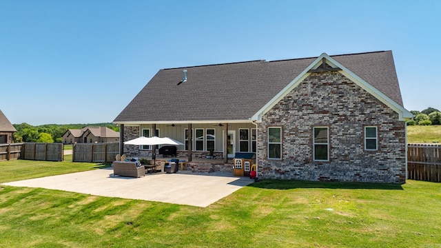 170 Irene Cir, Greenbrier, AR 72058 - back of property featuring a ceiling fan, a patio, brick siding, and roof with shingles
