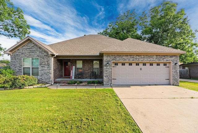 6 Jared Ln, Conway, AR 72032 - view of front of property featuring covered porch, a front lawn, concrete driveway, a garage, and stone siding