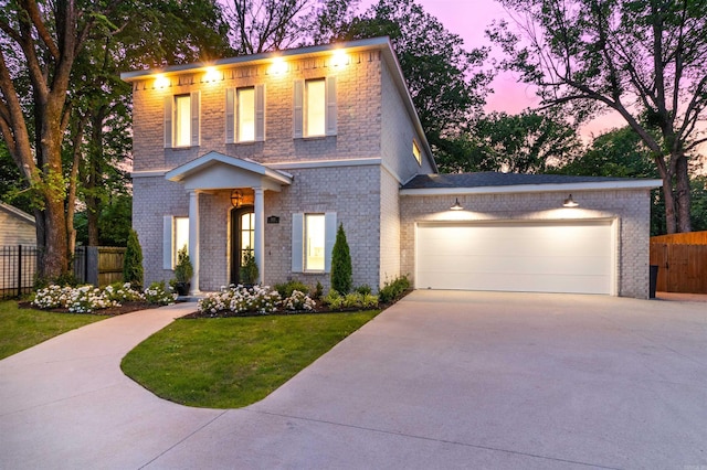 1615 N Garland Ave, Fayetteville, AR 72703 - view of front facade with a garage, concrete driveway, and brick siding