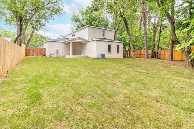 1615 N Garland Ave, Fayetteville, AR 72703 - rear view of property with central air condition unit and brick siding
