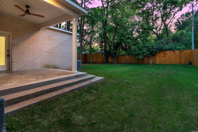 1615 N Garland Ave, Fayetteville, AR 72703 - yard at dusk with a ceiling fan