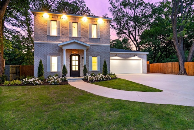 1615 N Garland Ave, Fayetteville, AR 72703 - view of front facade with driveway, a garage, and brick siding