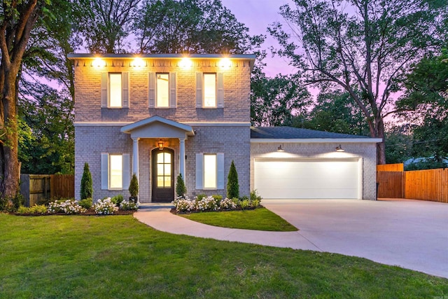 1615 N Garland Ave, Fayetteville, AR 72703 - view of front of home with concrete driveway, an attached garage, and brick siding