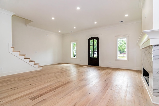 1615 N Garland Ave, Fayetteville, AR 72703 - foyer featuring plenty of natural light, a premium fireplace, ornamental molding, light wood-type flooring, and baseboards