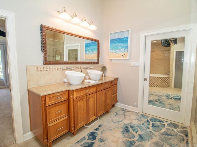 1 Witness Tree Ln, Paron, AR 72122 - full bathroom with double vanity, decorative backsplash, baseboards, and tile patterned floors