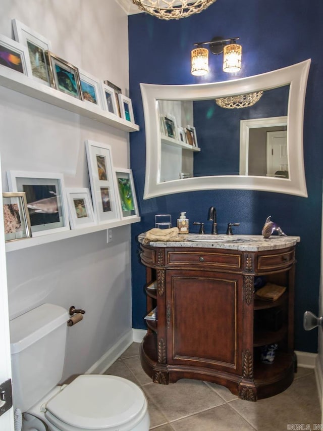 1 Witness Tree Ln, Paron, AR 72122 - bathroom with toilet, vanity, tile patterned flooring, and baseboards