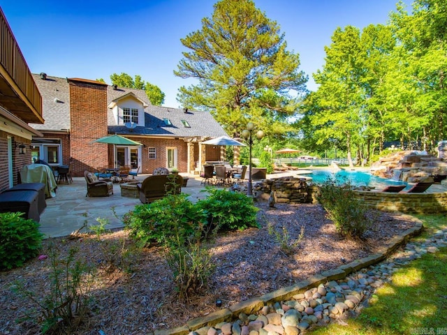 1 Witness Tree Ln, Paron, AR 72122 - view of yard with outdoor lounge area, a patio, and an outdoor pool
