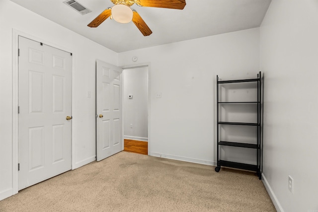 1050 Santa Fe Trl, Conway, AR 72034 - unfurnished bedroom with baseboards, ceiling fan, and carpet