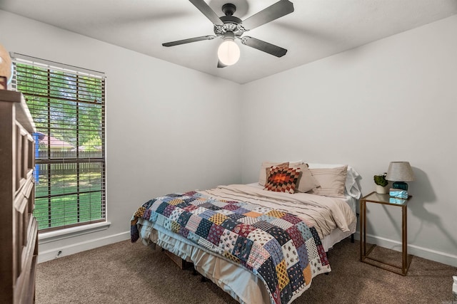 1050 Santa Fe Trl, Conway, AR 72034 - carpeted bedroom featuring multiple windows, baseboards, and a ceiling fan