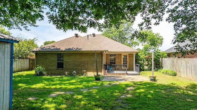 1050 Santa Fe Trl, Conway, AR 72034 - rear view of property with brick siding, a patio, and a shingled roof
