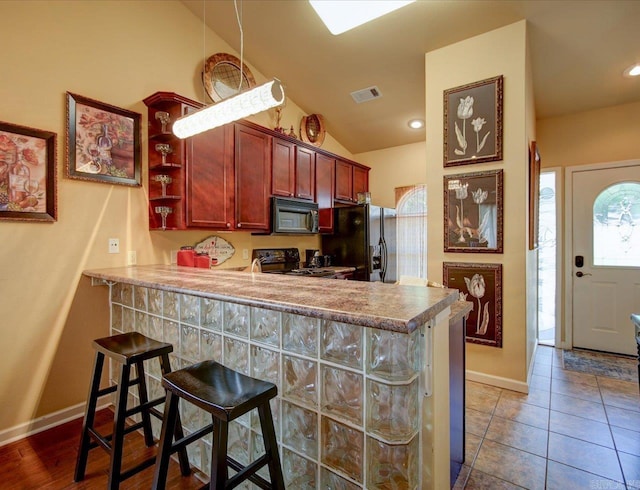 kitchen featuring black appliances, baseboards, vaulted ceiling, a peninsula, and open shelves