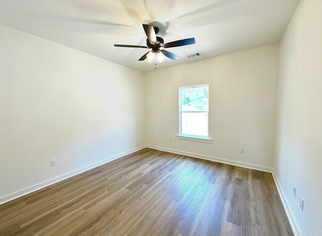 81 Lewis Loop, Greenbrier, AR 72058 - empty room with wood finished floors, baseboards, and ceiling fan