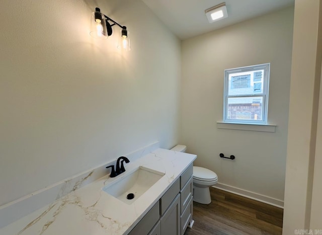 81 Lewis Loop, Greenbrier, AR 72058 - bathroom featuring vanity, toilet, baseboards, and wood finished floors