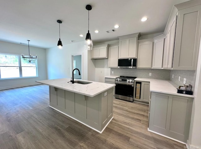 81 Lewis Loop, Greenbrier, AR 72058 - kitchen with appliances with stainless steel finishes, a sink, decorative backsplash, wood finished floors, and recessed lighting