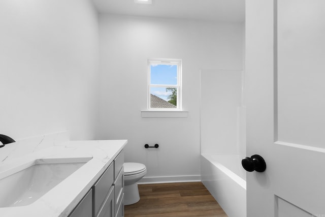 81 Lewis Loop, Greenbrier, AR 72058 - bathroom featuring toilet, vanity, wood finished floors, and baseboards