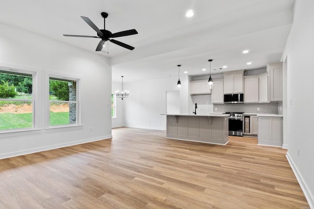 81 Lewis Loop, Greenbrier, AR 72058 - unfurnished living room with light wood-style floors, a sink, recessed lighting, ceiling fan, and baseboards