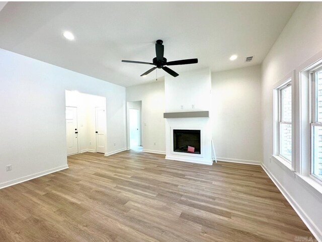 81 Lewis Loop, Greenbrier, AR 72058 - unfurnished living room with wood finished floors, a fireplace, ceiling fan, recessed lighting, and baseboards