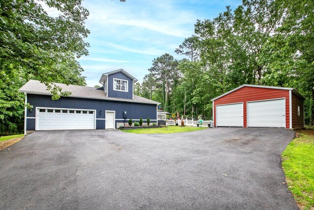 100 Hidgen Rdg, Higden, AR 72067 - view of front of home featuring an outdoor structure and a garage