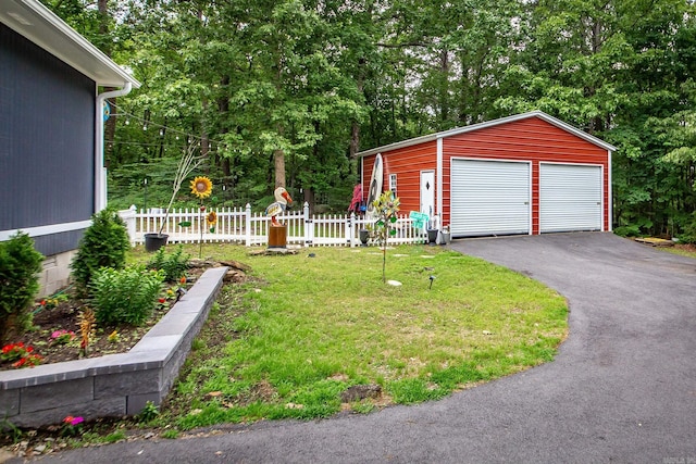100 Hidgen Rdg, Higden, AR 72067 - exterior space featuring a garage, an outbuilding, and view of wooded area