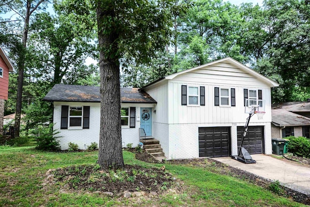 split level home with brick siding, driveway, an attached garage, and entry steps