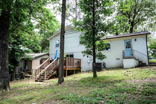 back of house with brick siding, central AC unit, stairway, and a wooden deck