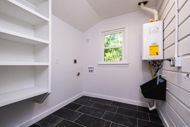 700 N Taylor St, Little Rock, AR 72205 - washroom featuring electric dryer hookup, water heater, baseboards, dark tile patterned flooring, and washer hookup