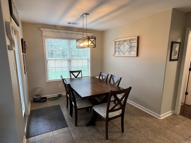 1056 Skyline Dr, Alexander, AR 72002 - dining space with dark tile patterned floors and baseboards