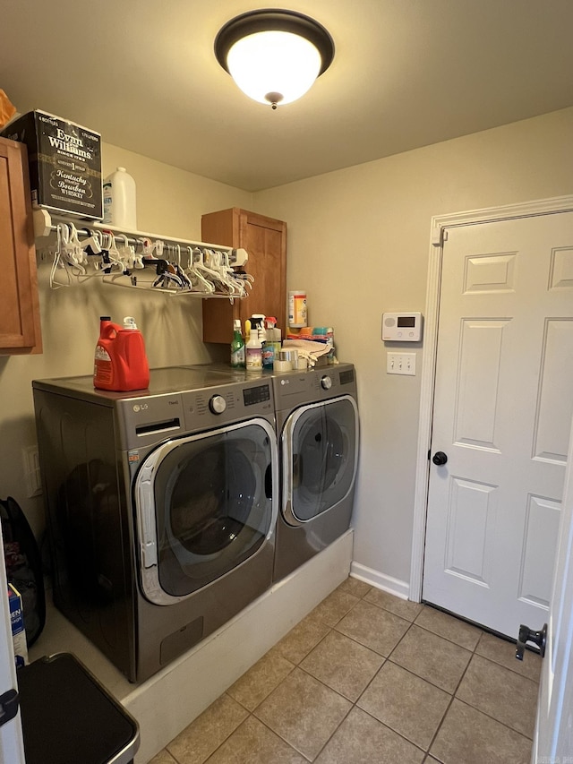 1056 Skyline Dr, Alexander, AR 72002 - laundry room with cabinet space, separate washer and dryer, light tile patterned floors, and baseboards
