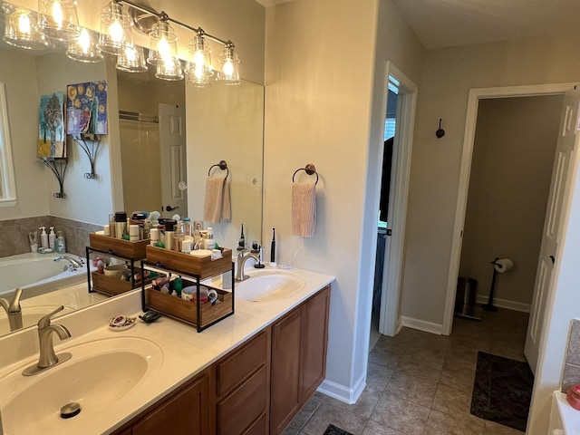 1056 Skyline Dr, Alexander, AR 72002 - bathroom featuring double vanity, a garden tub, tile patterned flooring, and baseboards