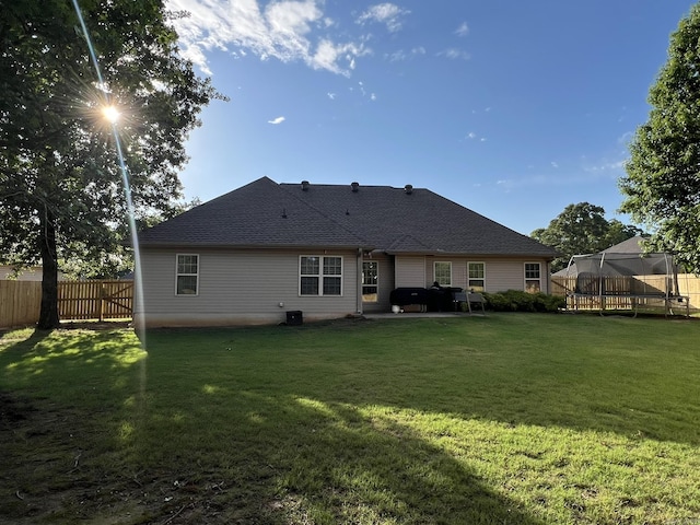 1056 Skyline Dr, Alexander, AR 72002 - rear view of property with a trampoline, a patio, and roof with shingles