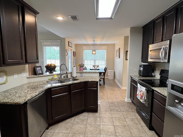 1056 Skyline Dr, Alexander, AR 72002 - kitchen with stainless steel appliances, a sink, light tile patterned floors, a peninsula, and light stone counters