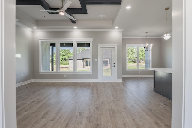 11 Brixton, Cabot, AR 72023 - unfurnished living room featuring a ceiling fan, a chandelier, baseboards, wood finished floors, and crown molding