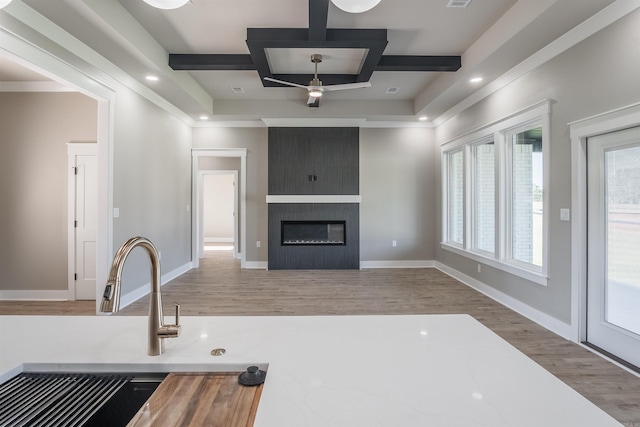 11 Brixton, Cabot, AR 72023 - kitchen with coffered ceiling, wood finished floors, a large fireplace, beamed ceiling, and baseboards