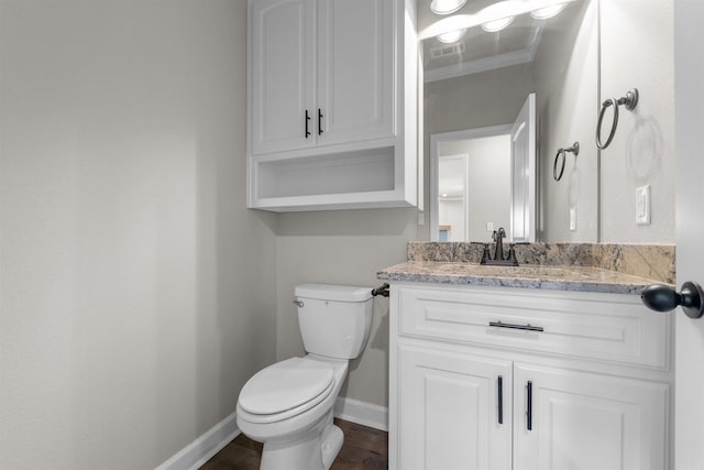 10114 Hidden Cir, Sherwood, AR 72120 - bathroom featuring baseboards, toilet, vanity, and wood finished floors