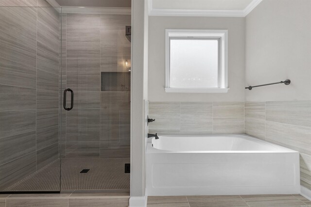 10114 Hidden Cir, Sherwood, AR 72120 - full bath featuring a garden tub, a shower stall, crown molding, and tile patterned floors