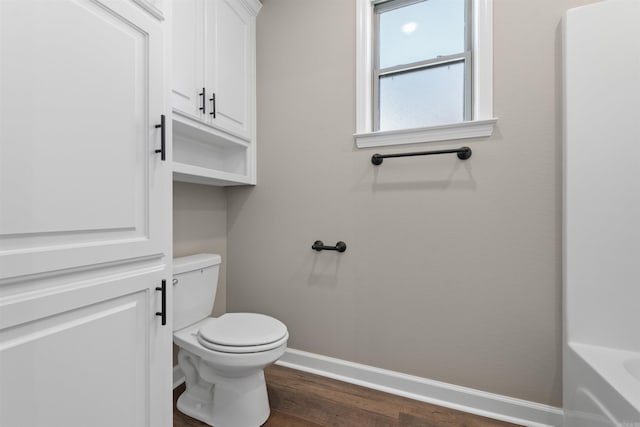 10114 Hidden Cir, Sherwood, AR 72120 - bathroom with baseboards, toilet, and wood finished floors
