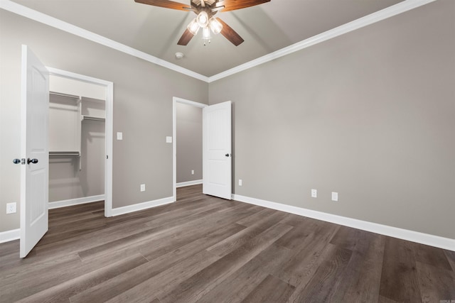 10114 Hidden Cir, Sherwood, AR 72120 - unfurnished bedroom with ornamental molding, dark wood-style flooring, baseboards, a spacious closet, and ceiling fan