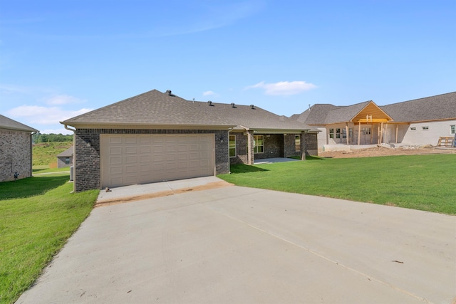 10114 Hidden Cir, Sherwood, AR 72120 - view of front facade with driveway, a front lawn, an attached garage, and brick siding