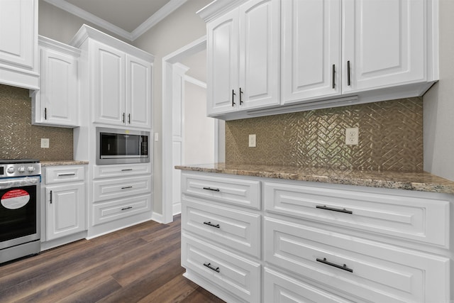 10114 Hidden Cir, Sherwood, AR 72120 - kitchen featuring appliances with stainless steel finishes, crown molding, dark wood finished floors, white cabinetry, and tasteful backsplash