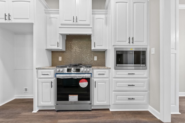 10114 Hidden Cir, Sherwood, AR 72120 - kitchen with stainless steel appliances, custom range hood, decorative backsplash, white cabinetry, and light stone counters
