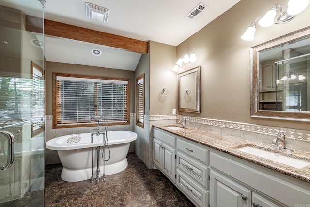 21 Constantina Cir, Hot Springs Village, AR 71909 - full bathroom featuring tile walls, double vanity, a stall shower, a freestanding bath, and wainscoting
