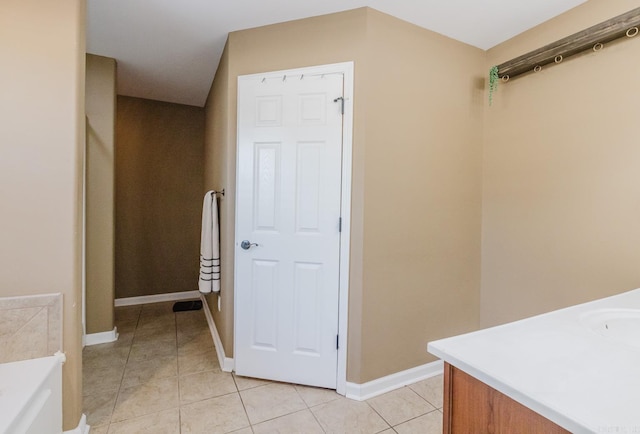 3961 Mountaincrest Cir, Alexander, AR 72002 - bathroom featuring vanity, tile patterned floors, a bath, and baseboards