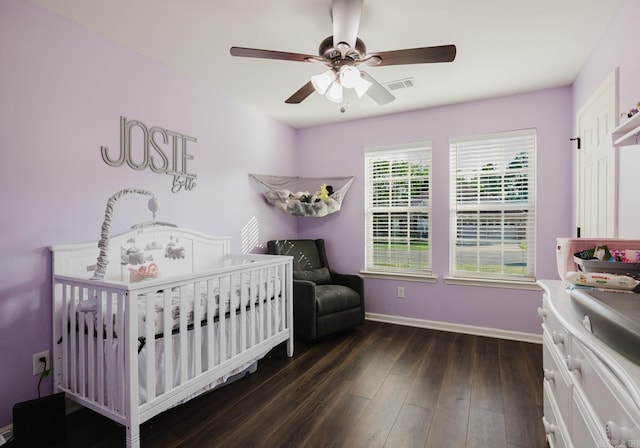 3961 Mountaincrest Cir, Alexander, AR 72002 - bedroom featuring wood finished floors, a crib, baseboards, and ceiling fan