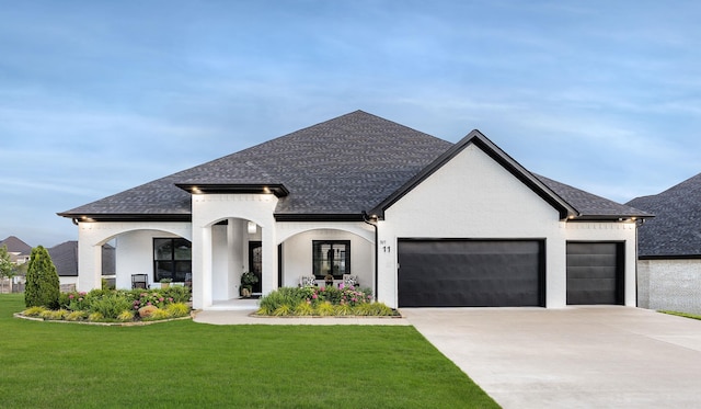 11 Haywood Ct, Little Rock, AR 72223 - french country style house with a garage, concrete driveway, a front lawn, and a shingled roof