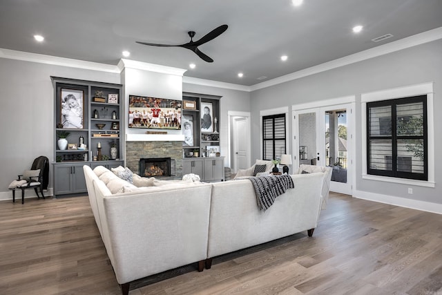 11 Haywood Ct, Little Rock, AR 72223 - living room featuring a fireplace, ceiling fan, ornamental molding, wood finished floors, and recessed lighting