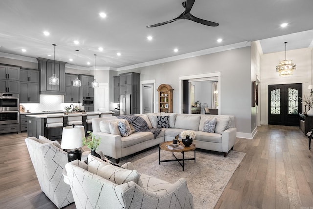 11 Haywood Ct, Little Rock, AR 72223 - living room with ornamental molding, ceiling fan, recessed lighting, baseboards, and french doors
