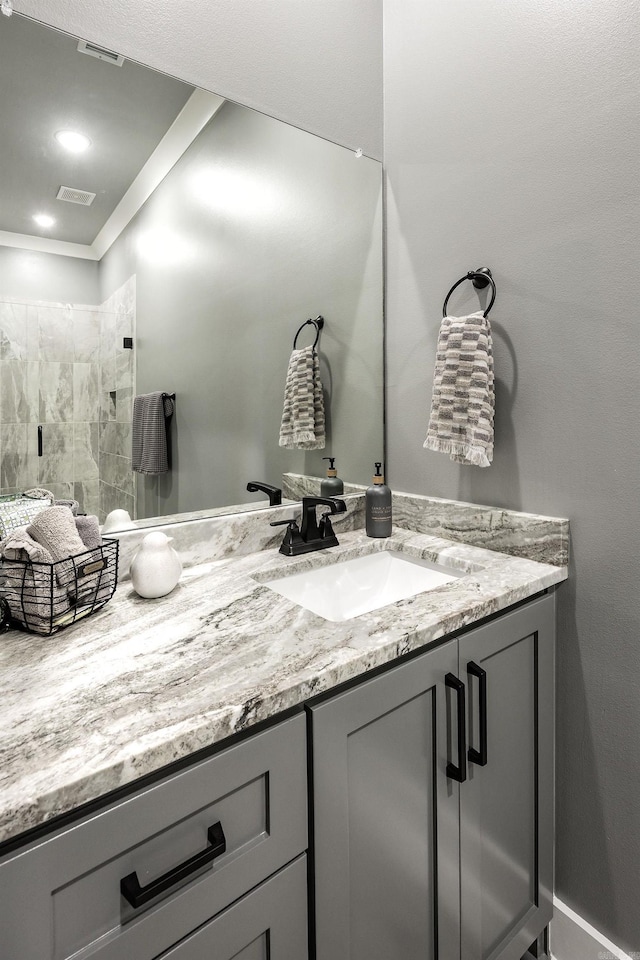 11 Haywood Ct, Little Rock, AR 72223 - bathroom with vanity, ornamental molding, and a tile shower