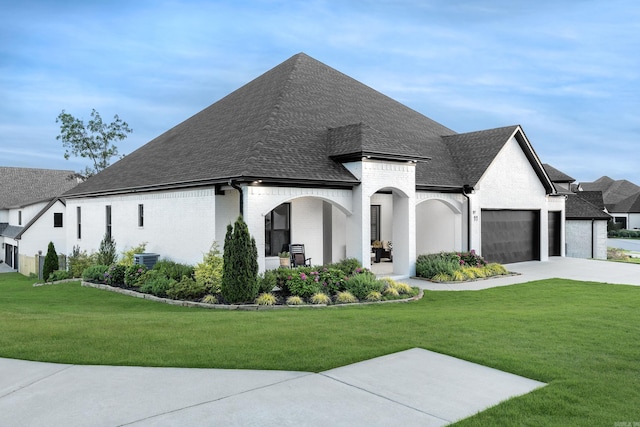 11 Haywood Ct, Little Rock, AR 72223 - view of front of property featuring a garage, a front yard, brick siding, and roof with shingles