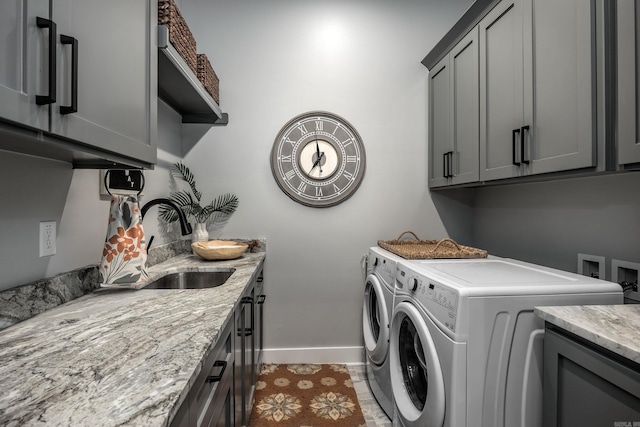 11 Haywood Ct, Little Rock, AR 72223 - laundry area featuring washer and clothes dryer, cabinet space, and baseboards