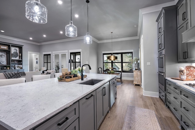 11 Haywood Ct, Little Rock, AR 72223 - kitchen with a sink, stainless steel appliances, light stone countertops, healthy amount of natural light, and recessed lighting